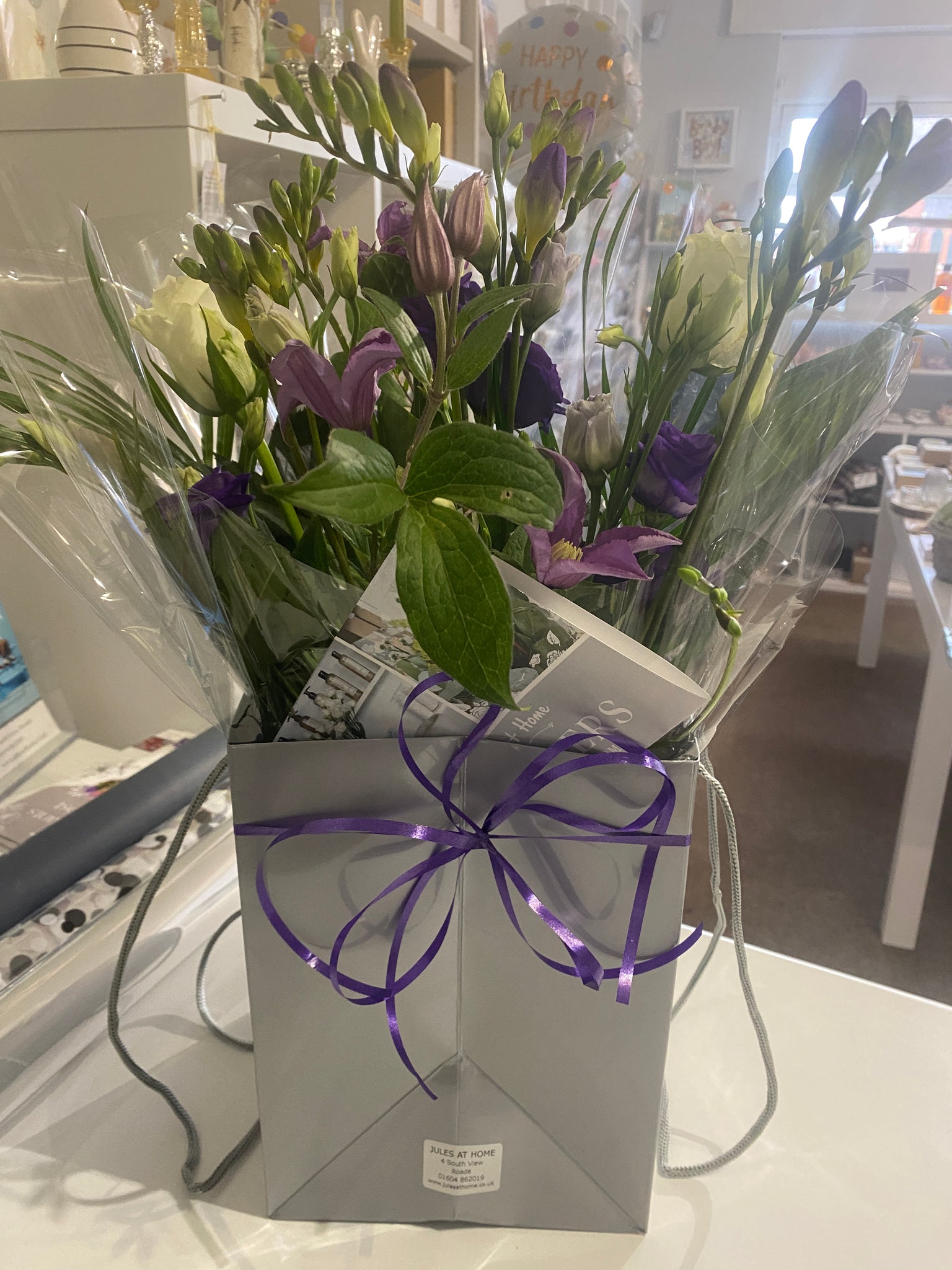 Purple themed fresh flower bag